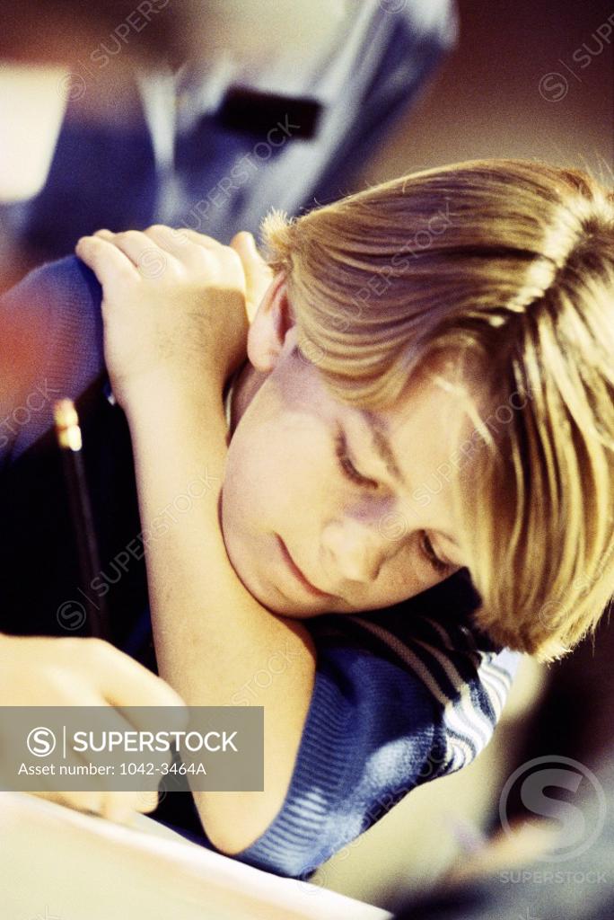 Stock Photo: 1042-3464A Boy writing in a book