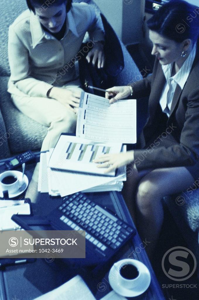 Stock Photo: 1042-3469 High angle view of two businesswomen in a meeting
