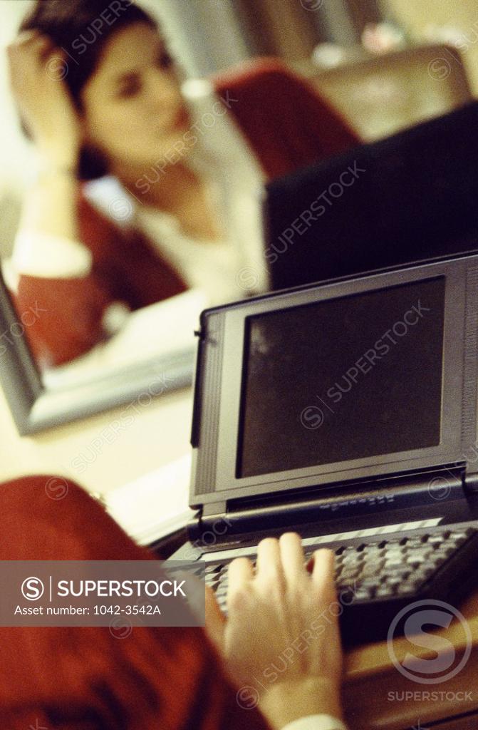 Stock Photo: 1042-3542A Businesswoman working on a laptop
