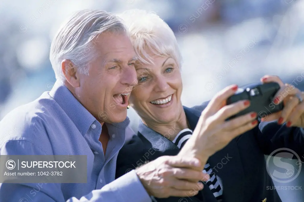 Senior couple taking a photo of themselves
