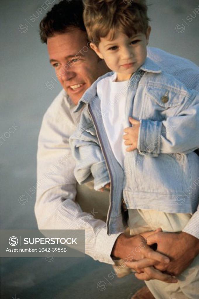 Stock Photo: 1042-3956B Father holding his son