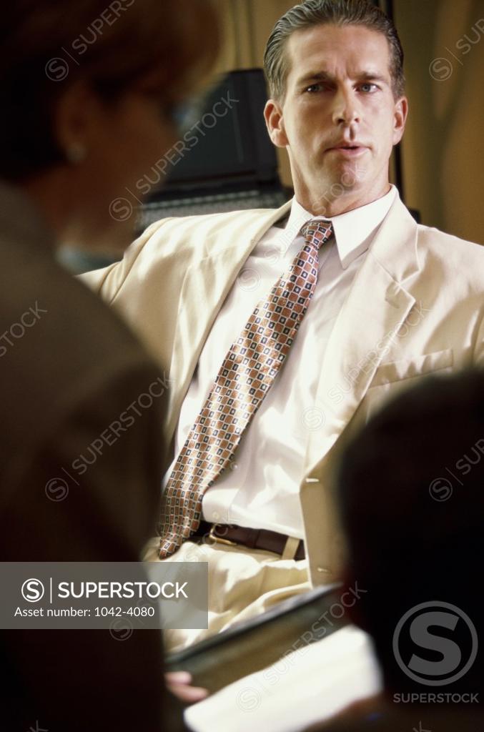 Stock Photo: 1042-4080 Businessman sitting on a chair in an office