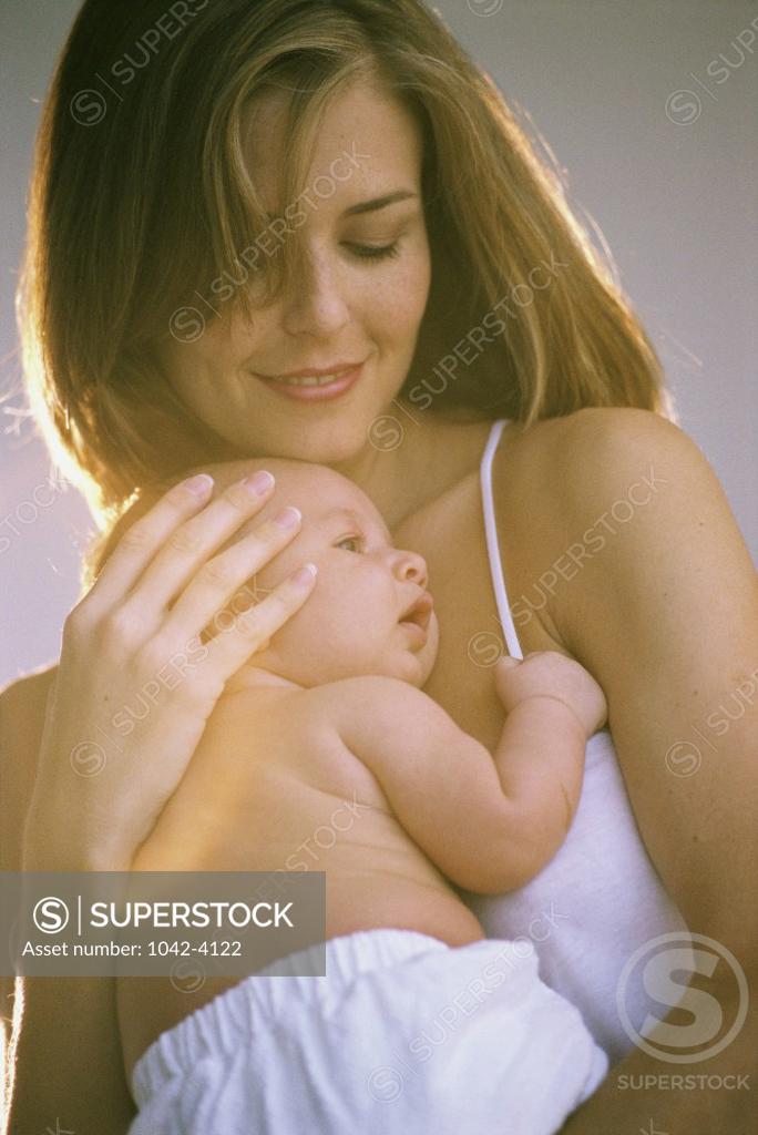 Stock Photo: 1042-4122 Close-up of a mother carrying her baby boy