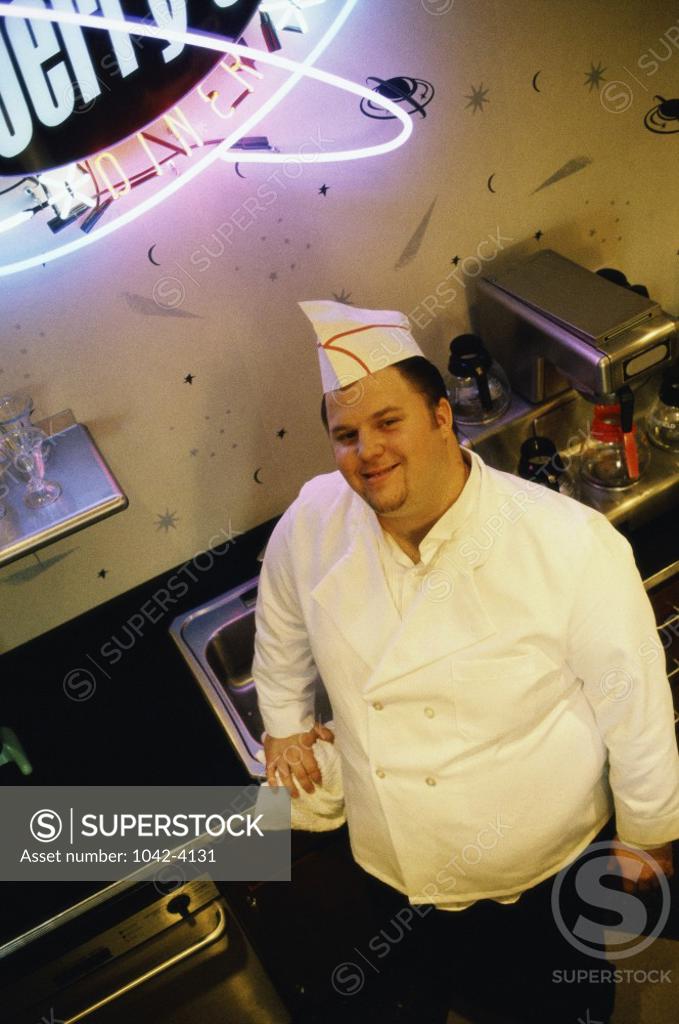 Stock Photo: 1042-4131 Portrait of a male chef smiling