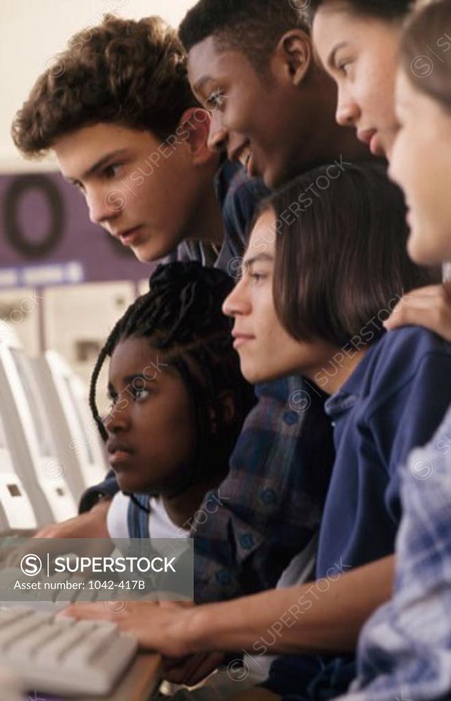 Stock Photo: 1042-417B Group of teenagers in a computer lab