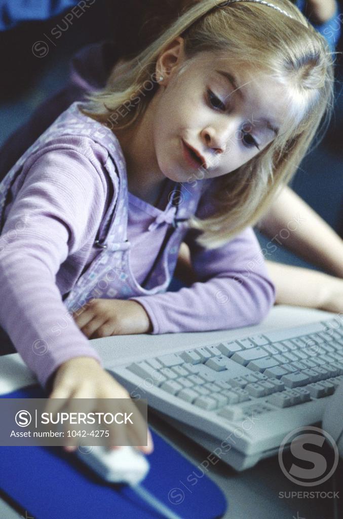 Stock Photo: 1042-4275 Girl holding a computer mouse