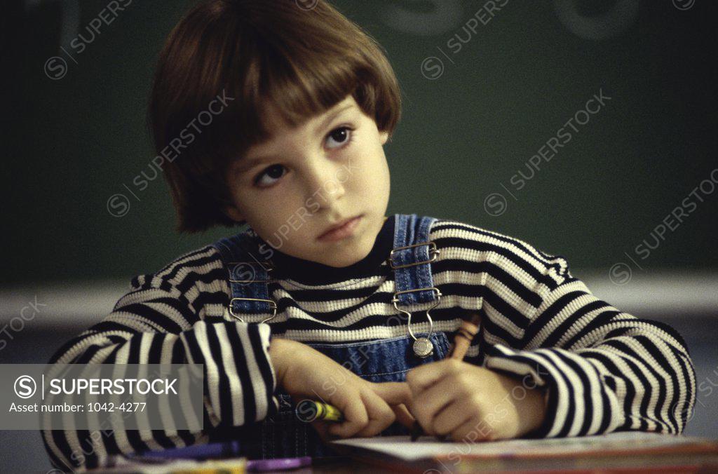 Stock Photo: 1042-4277 Girl sitting in a classroom