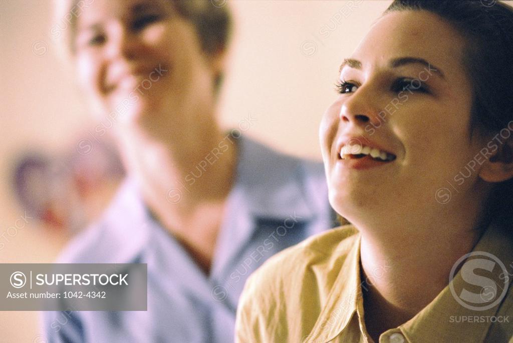 Stock Photo: 1042-4342 Close-up of a young woman smiling with her mother