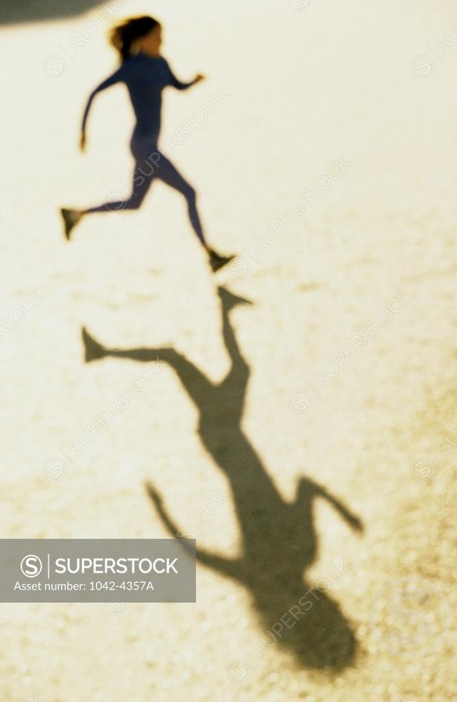 Stock Photo: 1042-4357A High angle view of a young woman jogging