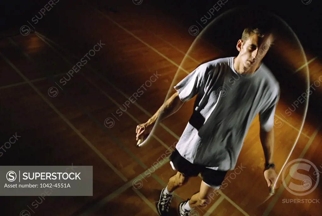 Young man jumping a rope