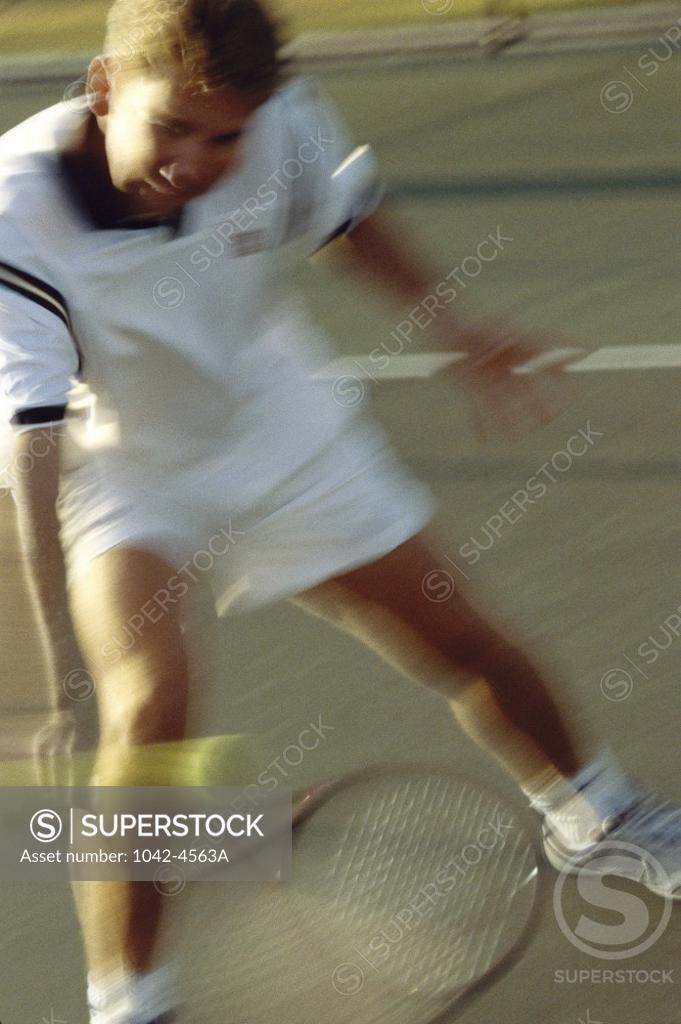 Stock Photo: 1042-4563A Young man playing tennis