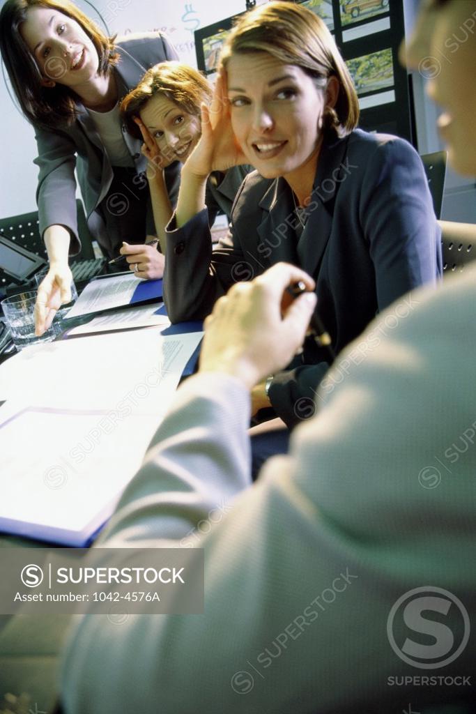 Stock Photo: 1042-4576A Group of businesswomen talking in an office