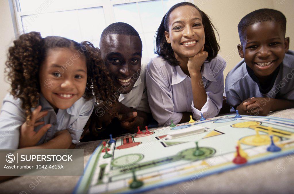 Stock Photo: 1042-4615A Portrait of parents with their daughter and son smiling