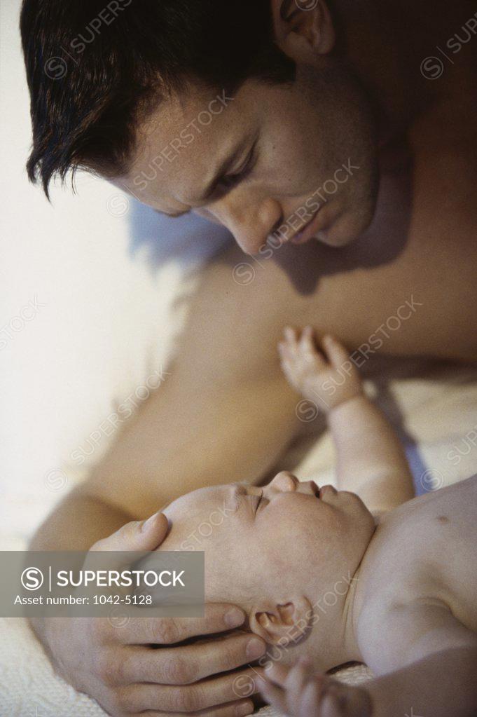 Stock Photo: 1042-5128 Close-up of a father holding his baby boy