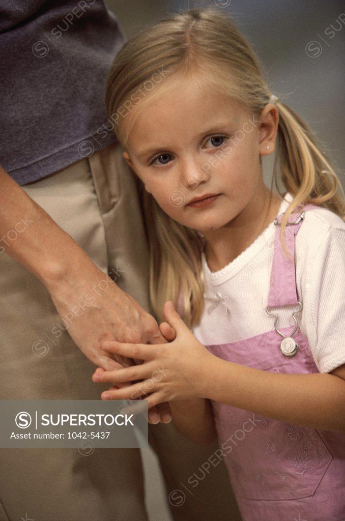 Stock Photo: 1042-5437 Close-up of a girl holding a woman's hand