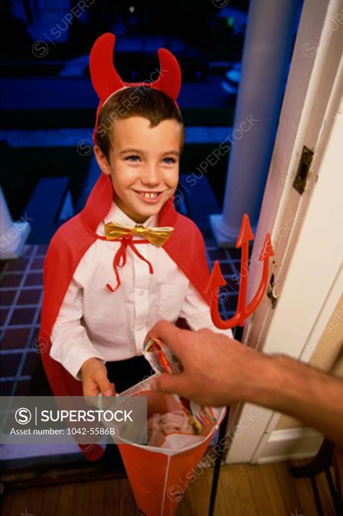 Stock Photo: 1042-5586B High angle view of a boy dressed as the devil on Halloween