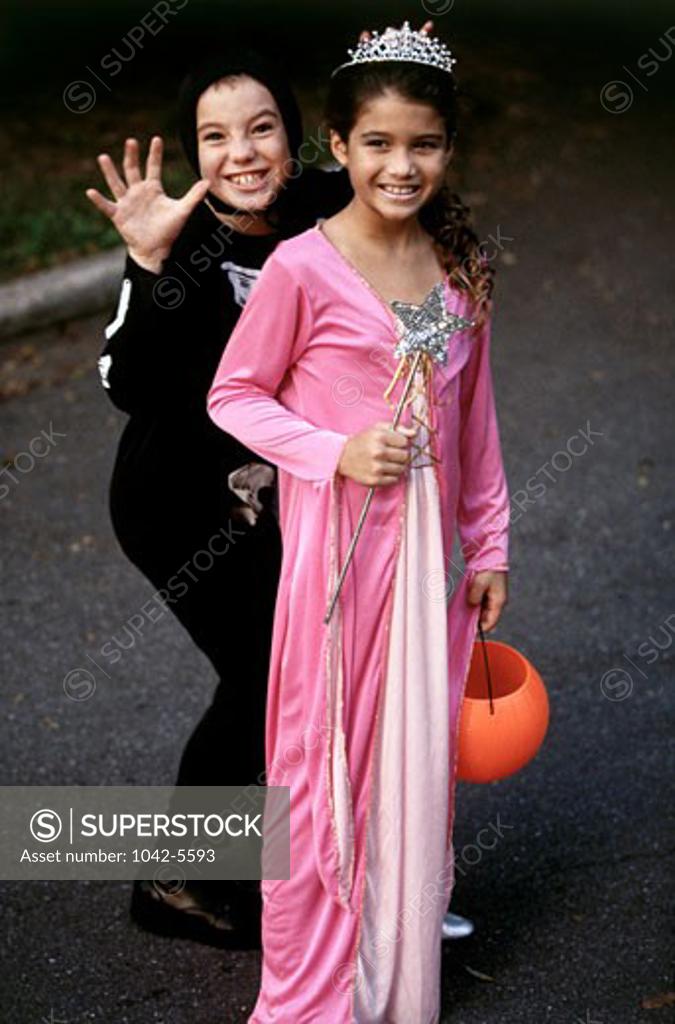 Stock Photo: 1042-5593 Girl in a princess costume and another girl standing behind her