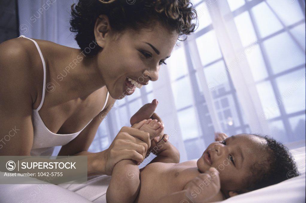 Stock Photo: 1042-5755 Close-up of a mother playing with her baby boy