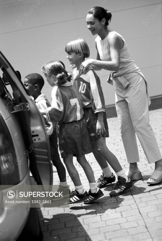 Stock Photo: 1042-5861 Mother standing with her children