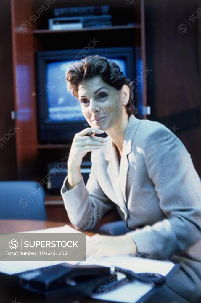 Stock Photo: 1042-6125B Portrait of a businesswoman with her hand on her chin