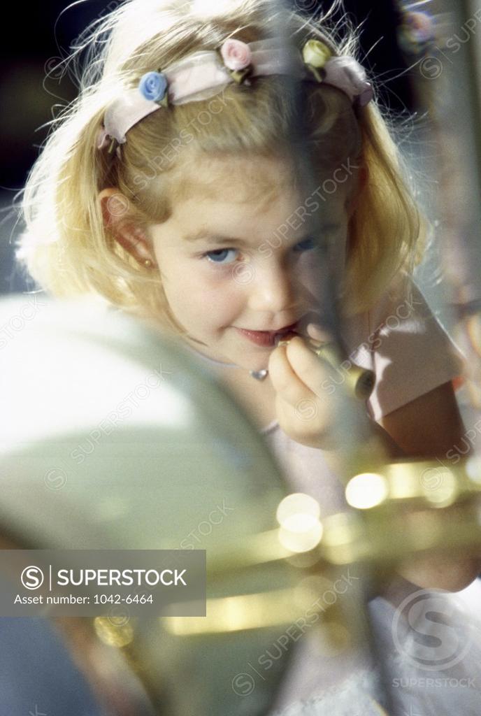 Stock Photo: 1042-6464 Close-up of a girl applying make-up