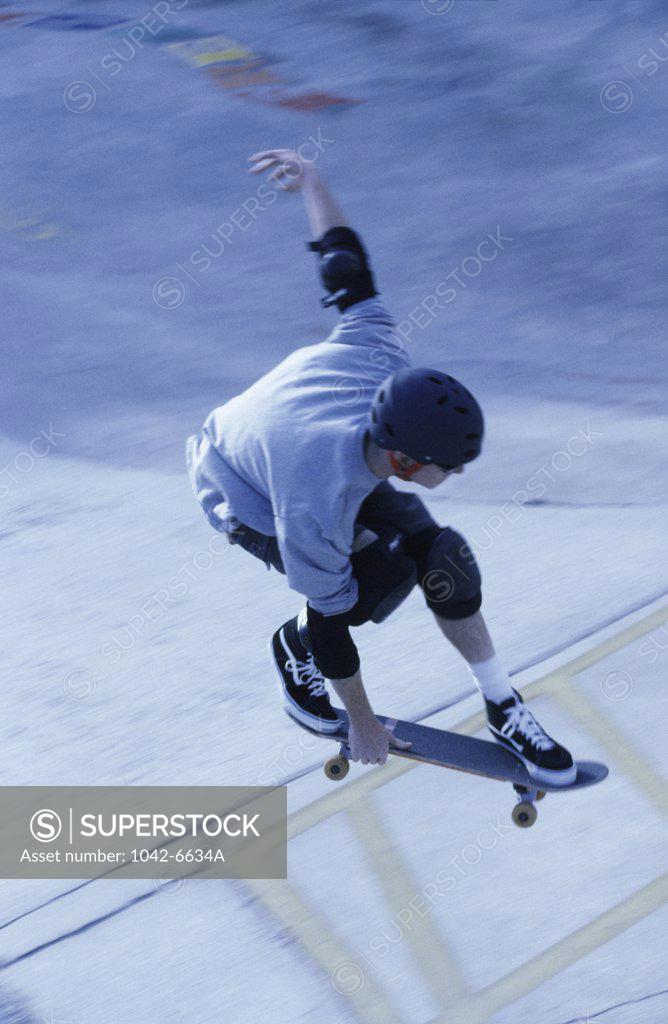 Stock Photo: 1042-6634A High angle view of a young man skateboarding