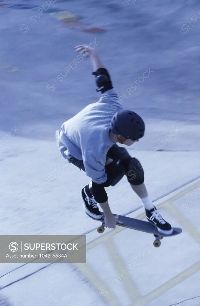 High angle view of a young man skateboarding