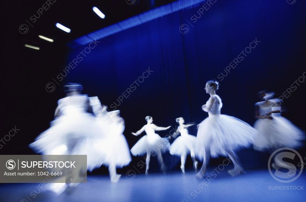 Stock Photo: 1042-6669 Low angle view of ballet dancers performing