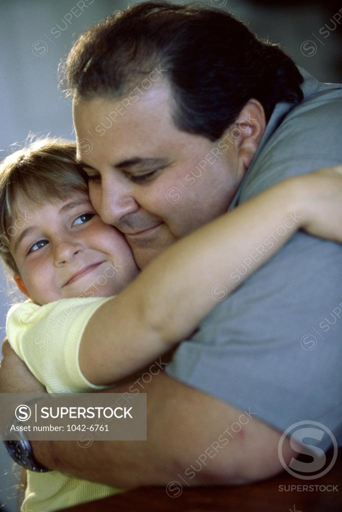 Stock Photo: 1042-6761 Close-up of a father hugging his daughter