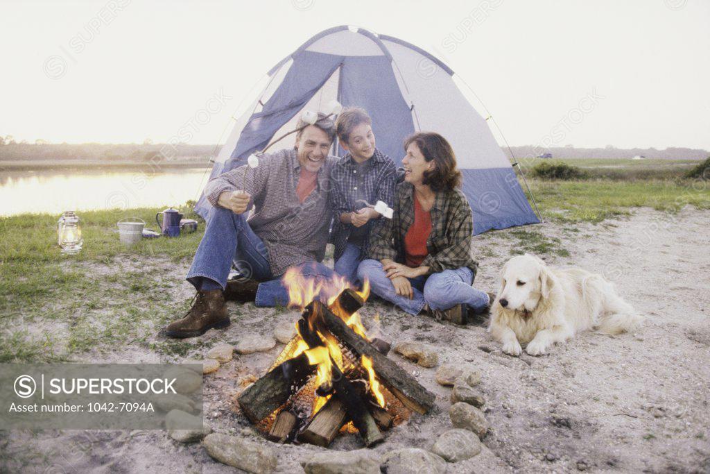 Stock Photo: 1042-7094A Parents with their son at a campsite