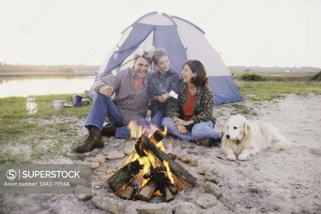 Parents with their son at a campsite