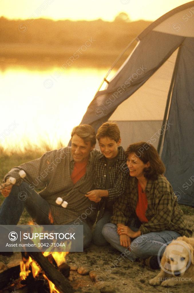 Stock Photo: 1042-7104A Parents with their son at a campsite
