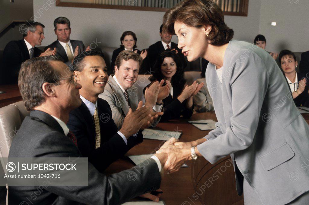 Stock Photo: 1042-716 Side profile of a group of business executives in a meeting