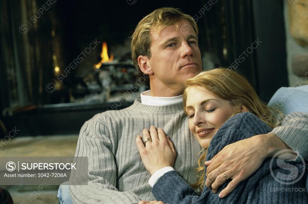 Stock Photo: 1042-7208A Mid adult man holding a mid adult woman