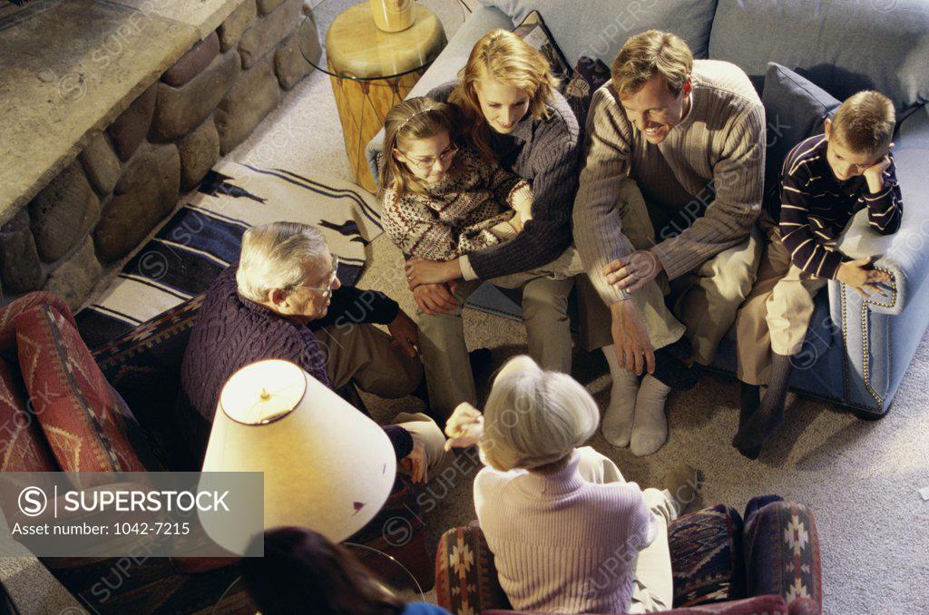 Stock Photo: 1042-7215 High angle view of a family sitting together talking