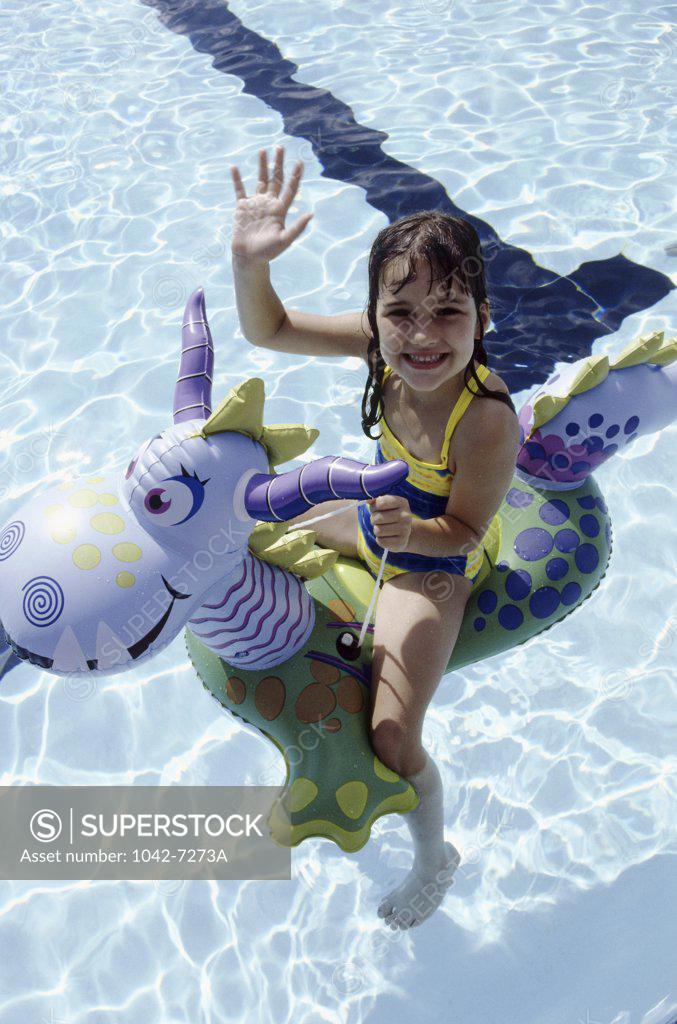 Stock Photo: 1042-7273A Portrait of a girl sitting on a inflatable ring