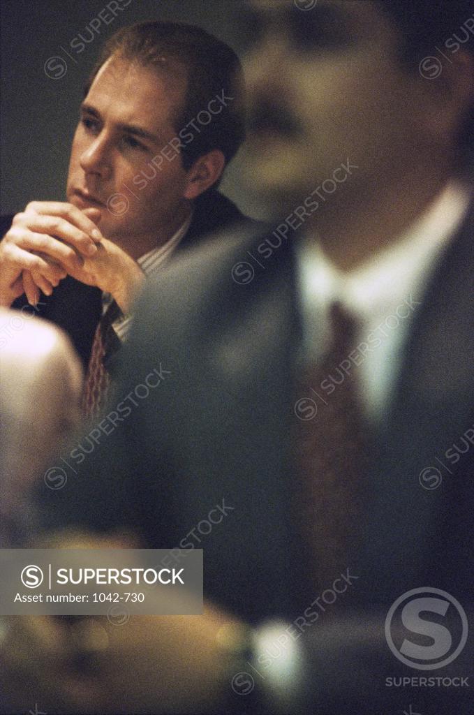 Stock Photo: 1042-730 Group of business executives in a meeting