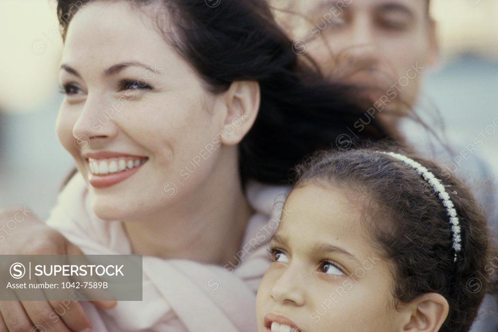 Stock Photo: 1042-7589B Parents with their daughter smiling