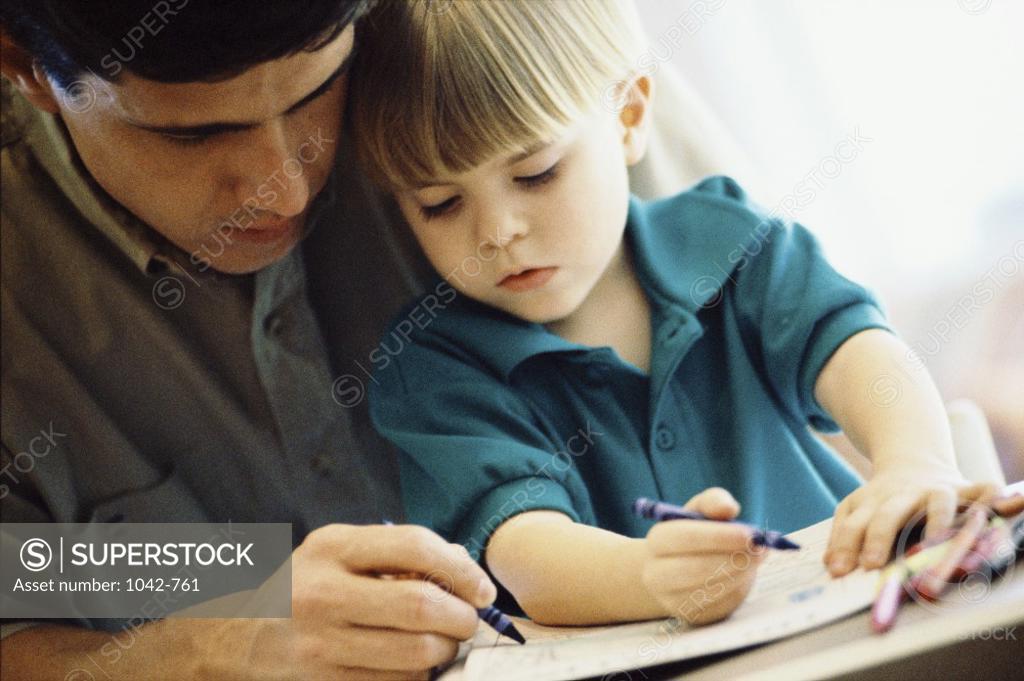Stock Photo: 1042-761 Father teaching his son