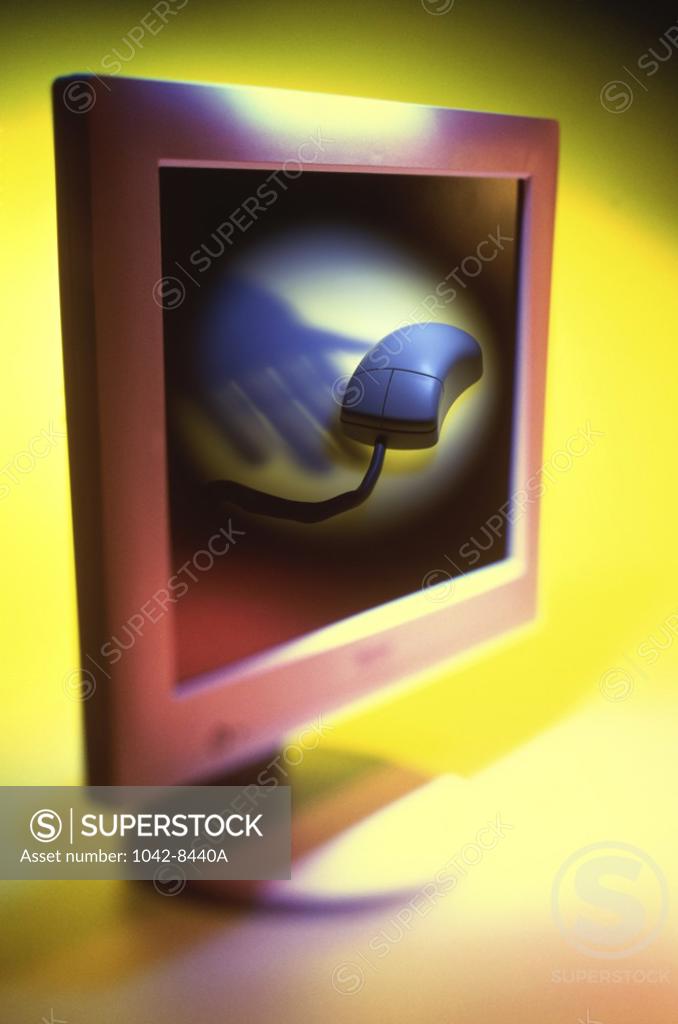 Stock Photo: 1042-8440A Close-up of a computer monitor with a computer mouse