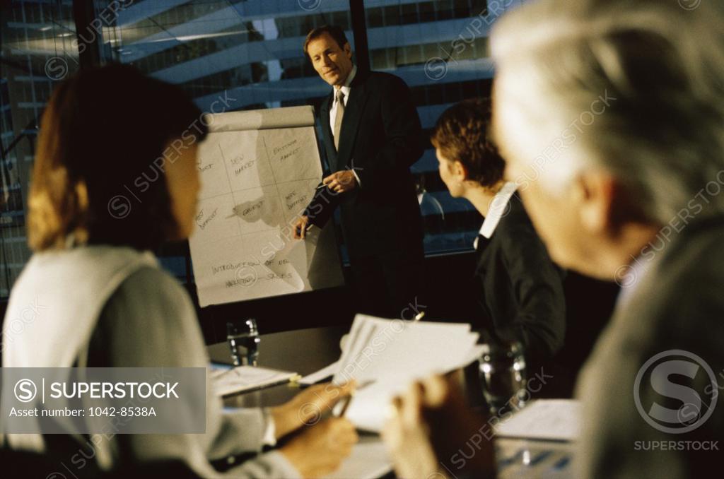Stock Photo: 1042-8538A Two businessmen and two businesswomen in an office