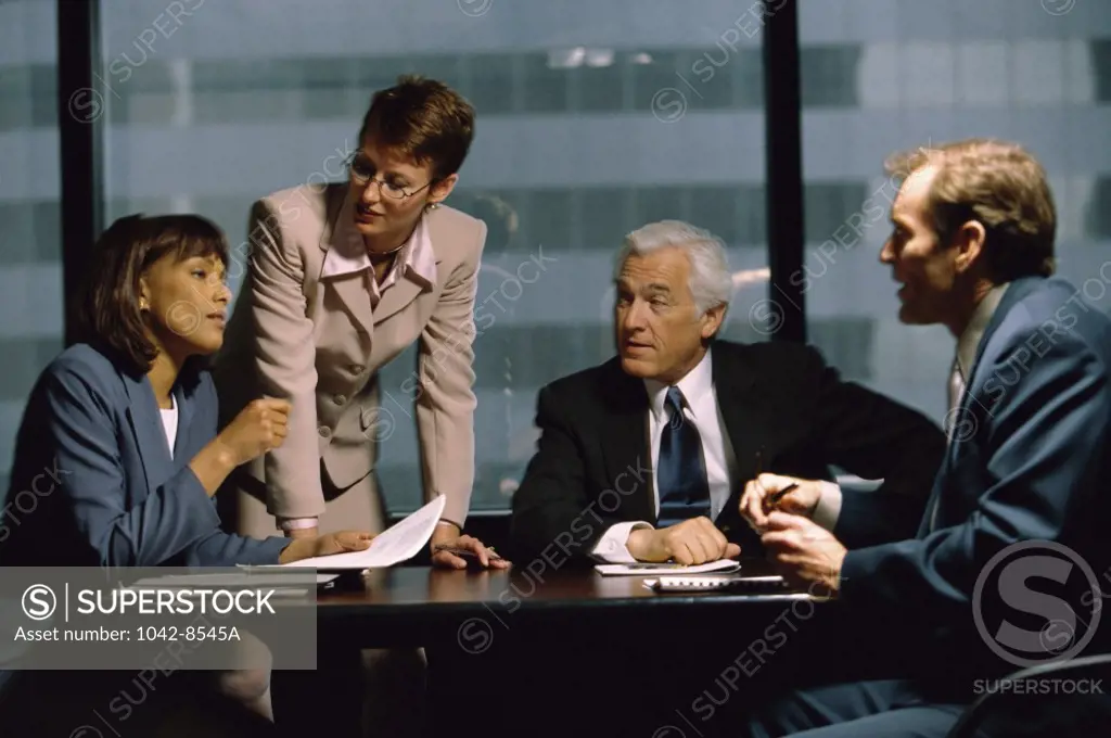 Two businessmen and two businesswomen in an office