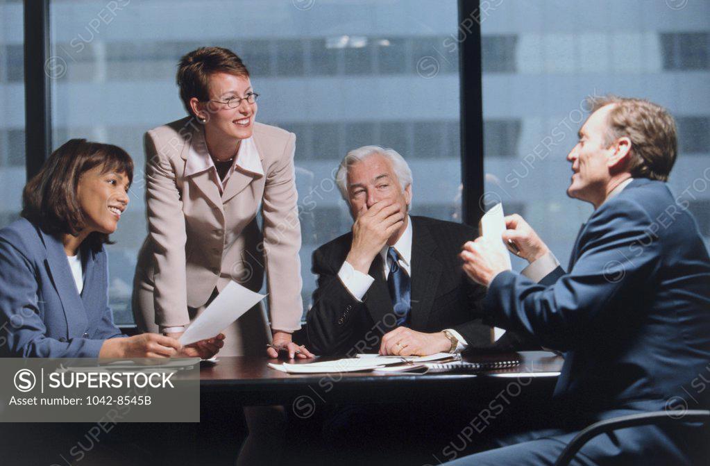 Stock Photo: 1042-8545B Two businesswomen and two businessmen in an office
