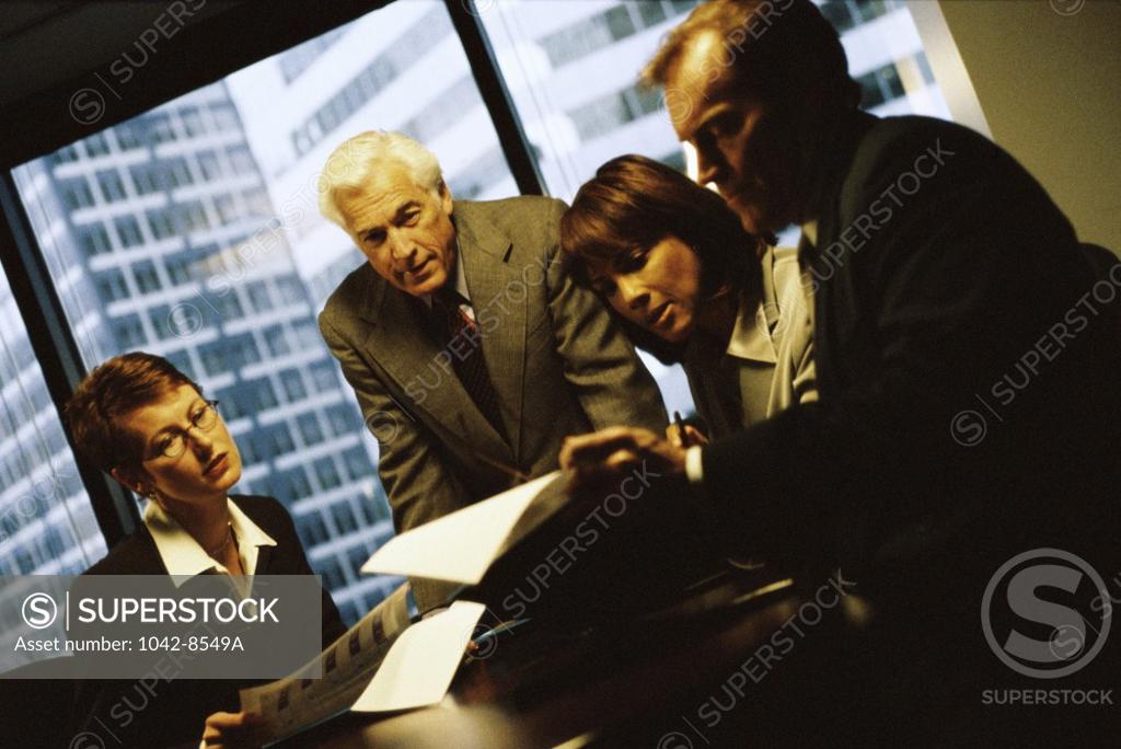 Stock Photo: 1042-8549A Two businessmen and two businesswomen in an office