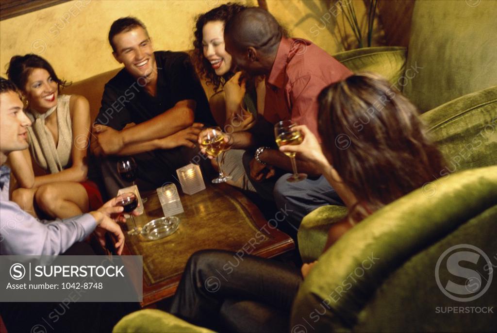 Stock Photo: 1042-8748 Group of young people making a toast