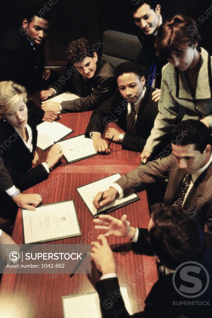 Stock Photo: 1042-882 Group of business executives in a conference room