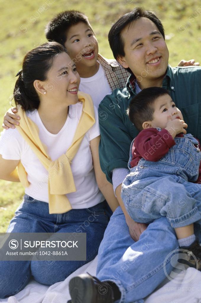 Stock Photo: 1042-8861A Close-up of parents with their two sons