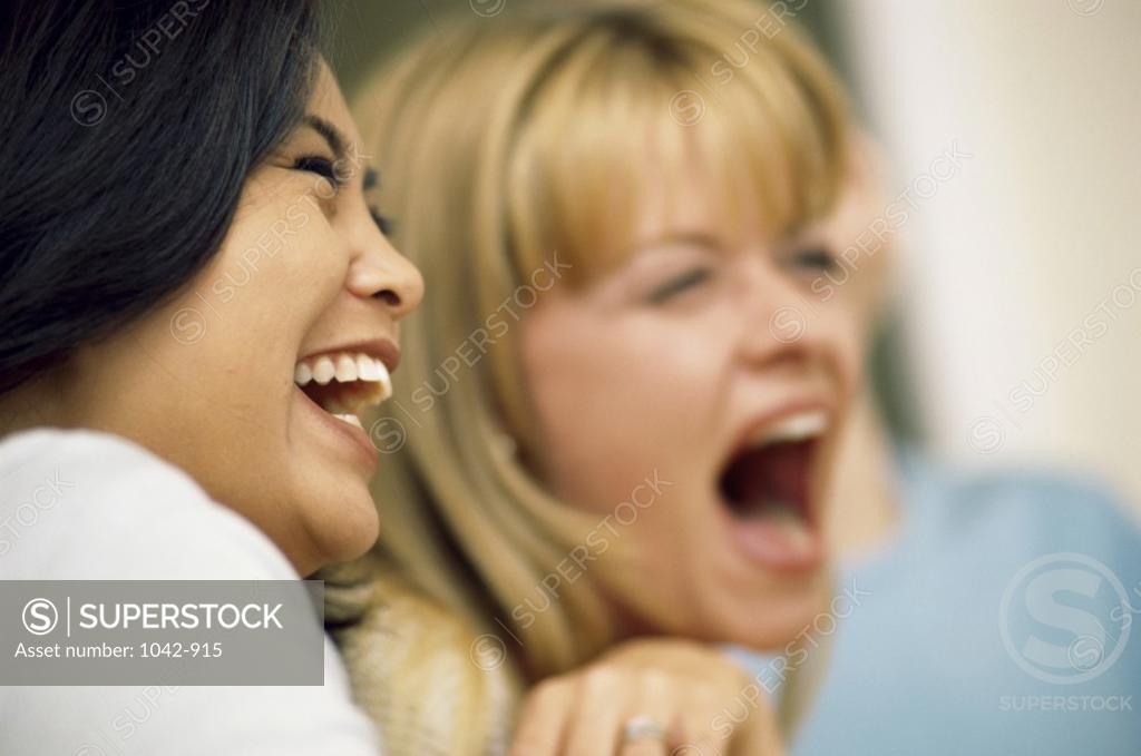 Stock Photo: 1042-915 Close-up of two young women laughing