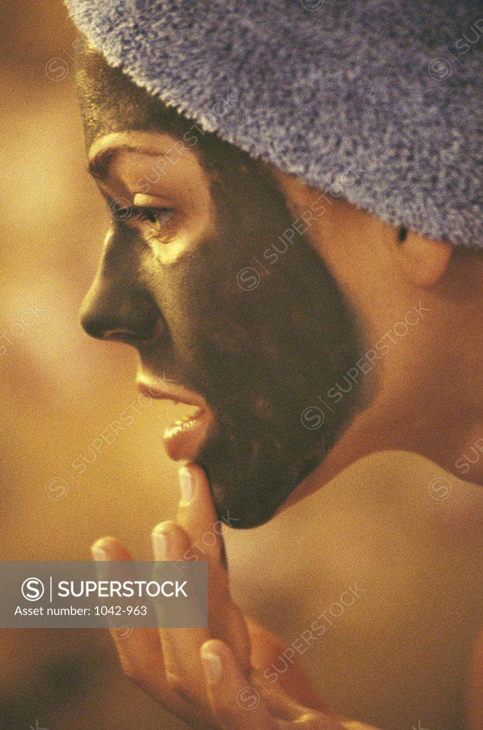 Stock Photo: 1042-963 Close-up of a young woman wearing a facial mask