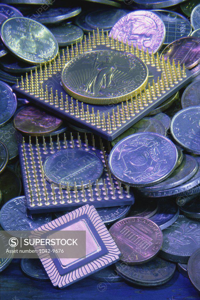 Stock Photo: 1042-9676 Close-up of computer chips and coins